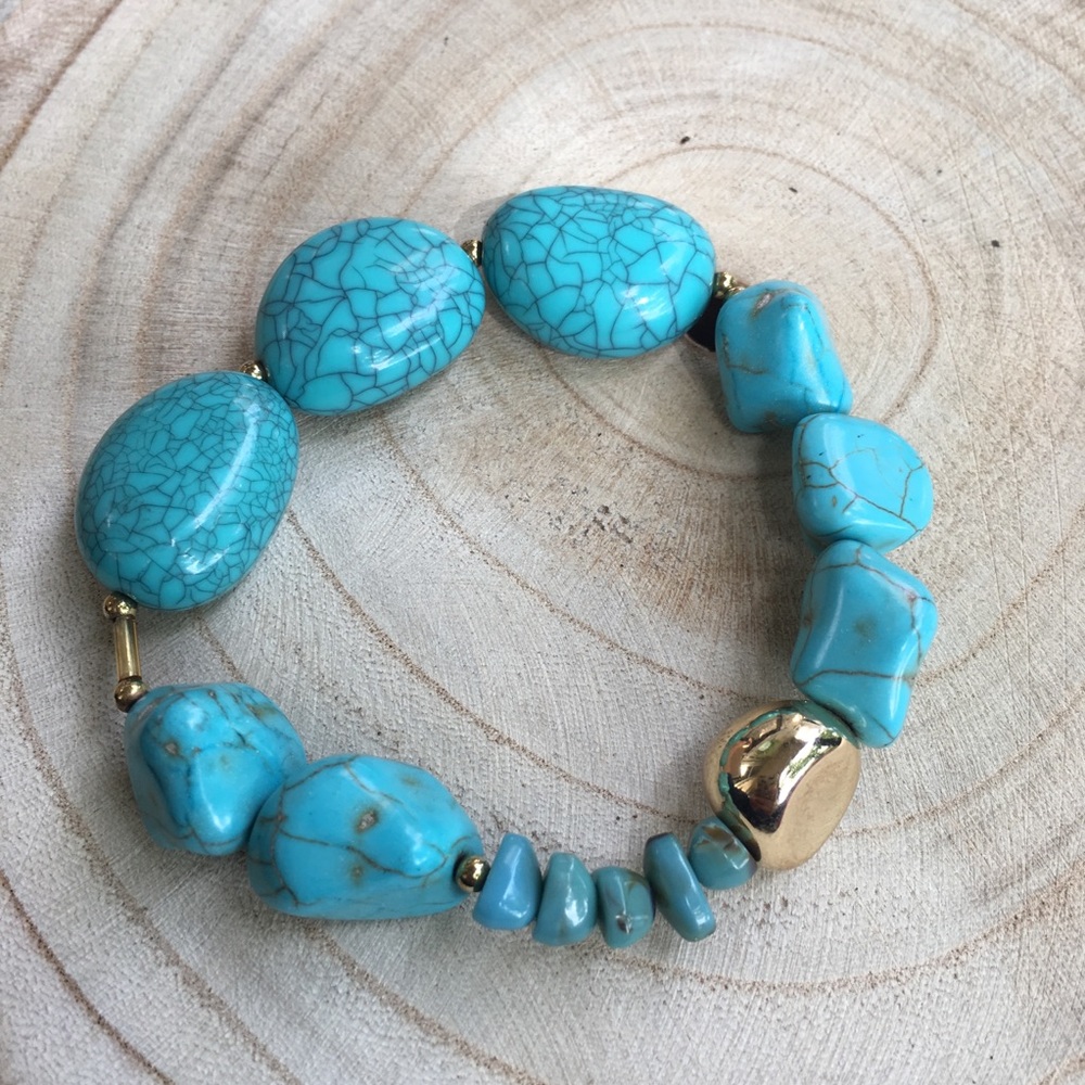 Turquoise and gold colored bead bracelet
